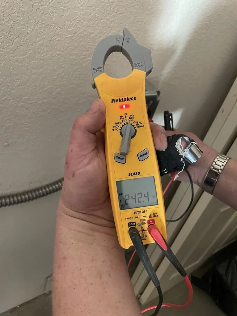 Voltage testing with clamp meter during Recessed Lighting Installation in Upper Darby